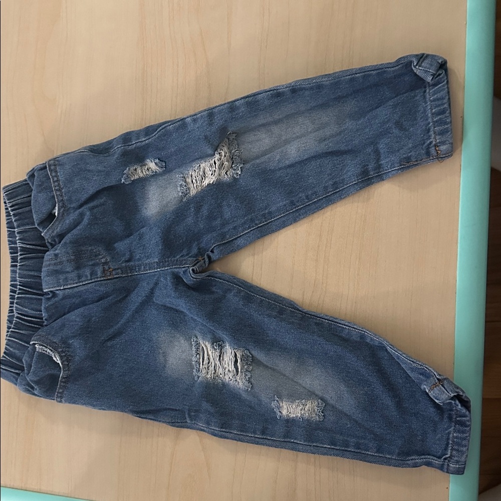 Distressed Blue Denim Jeans